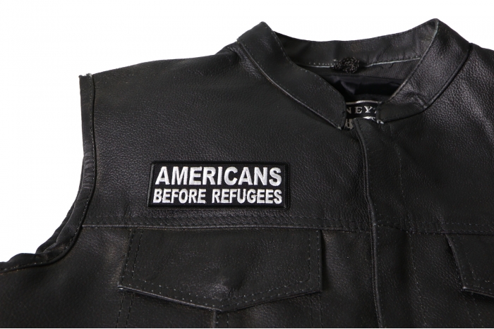 Americans Before Refugees Patch - 4x1.5 inch. Embroidered Iron on Patch shown on leather vest