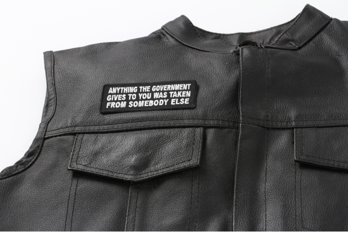 Anything The Government Gives To You Was Taken From Someone Else Patch - 4x1.5 inch - Embroidered Iron on Patch shown on leather vest