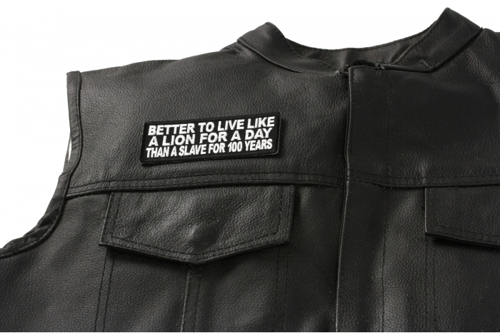 Better to Live Like A Lion for A Day Than A Slave for 100 Years Patch - 4x1.5 inch. Embroidered Iron on Patch shown on leather vest