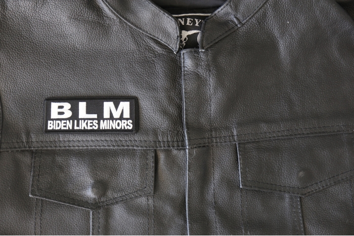 BLM Biden Likes Minors Patch - 4x1.5 inch - Embroidered Iron on Patch shown on leather vest