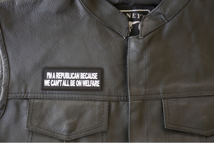 I'm Republican Because We Can't All Be on Welfare Patch - 4x1.5 inch. Embroidered Iron on Patch shown on leather vest