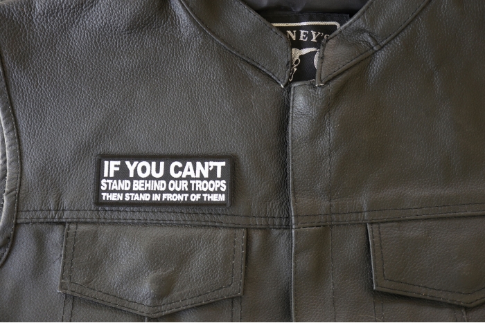If You Can't Stand Behind Our Troops Then Stand in Front of Them Patch, Military Saying Patches shown on leather vest
