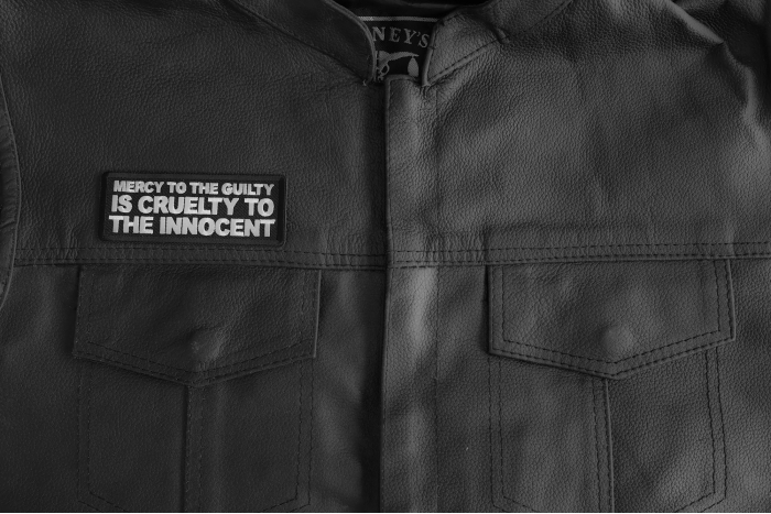 Mercy To The Guilty Is Cruelty To The Innocent Patch shown on leather vest