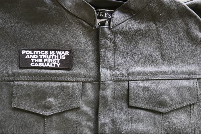 Politics is War and Truth is the First Casualty Patch, Patriotic Patches, Iron on Quotes and Sayings for Hats shown on leather vest
