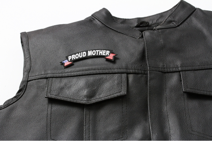 Proud Mother US Flag Rocker Patch - 4x1.5 inch. Embroidered Iron on Patch shown on leather vest