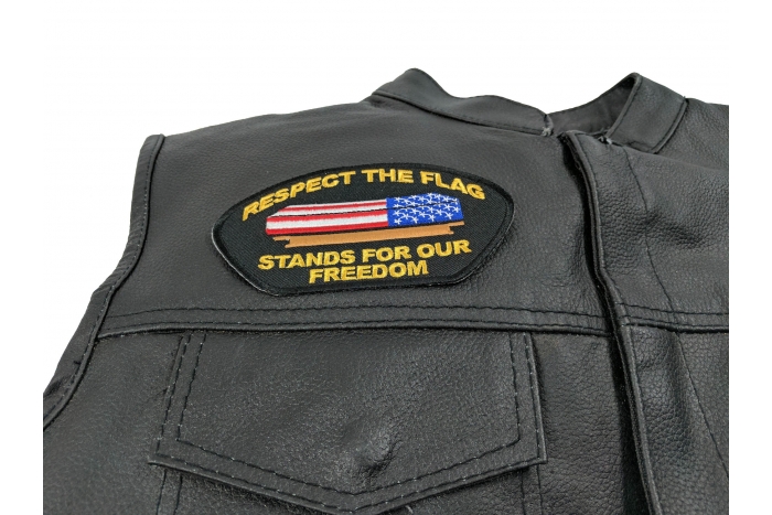 Respect Our Flag Cap Patch - 5x2.75 inch. Embroidered Iron on Patch shown on leather vest