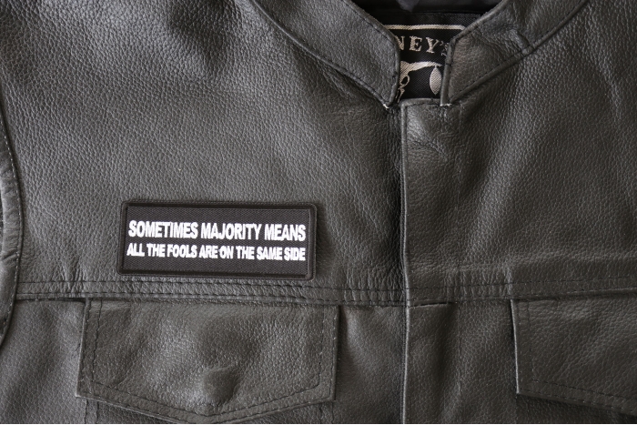 Sometimes the Majority Means all The Fools are On the Same Side Patch - 4x1.5 inch - Embroidered Iron on Patch shown on leather vest