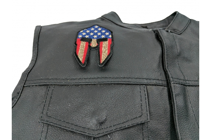 Spartan Helmet US Flag Patch - 2.5x4 inch. Embroidered Iron on Patch shown on leather vest