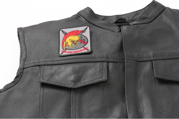 Spartan With Your Shield or On It Patch - 2.7x3.5 inch Embroidered Iron on Patch shown on leather vest