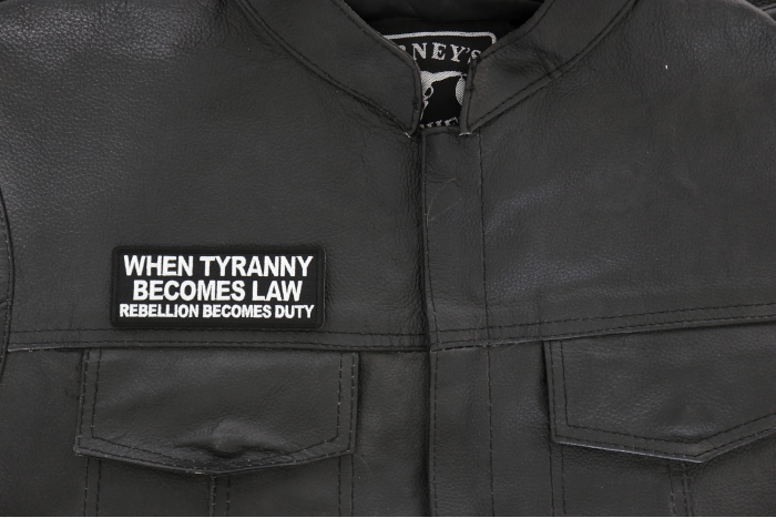 When Tyranny Becomes Law Rebellion Becomes Duty Patch, Patriotic Saying Patches shown on leather vest