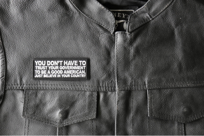 You Don't have to trust your Government to be a Good American, Just believe in your Country Patch, Patriotic Patches, Iron on Quotes and Sayings for Hats shown on leather vest