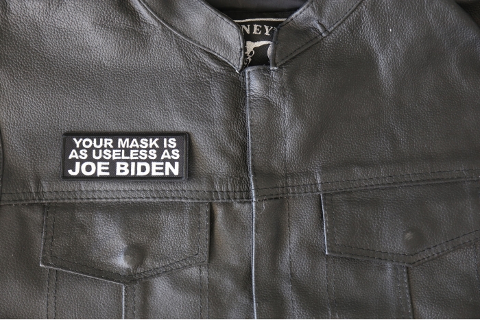 Your Mask is as Useless As Joe Biden Patch - 4x1.5 inch - Embroidered Iron on Patch shown on leather vest