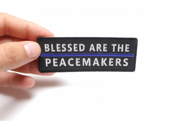 Blessed Are The Peacemakers Blue Line Patch shown on hand for size comparison
