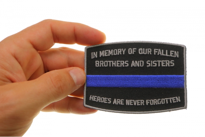 Fallen Officer Memorial Blue Line Patch shown on hand for size comparison