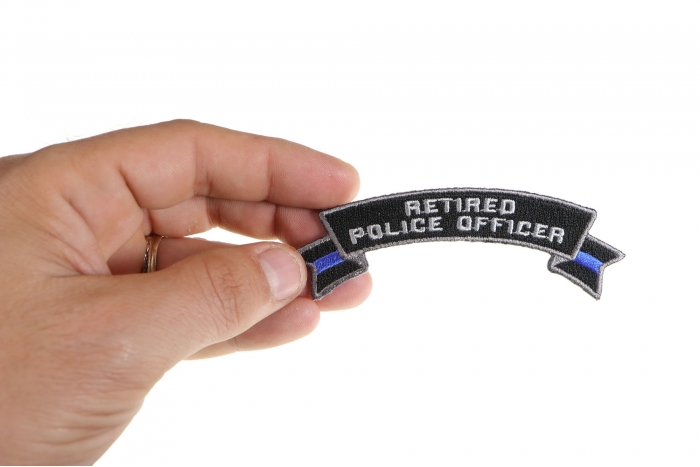 Retired Police Officer Rocker Patch shown on hand for size comparison