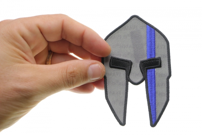 Spartan Helmet Blue Line Police Iron on Patch shown on hand for size comparison