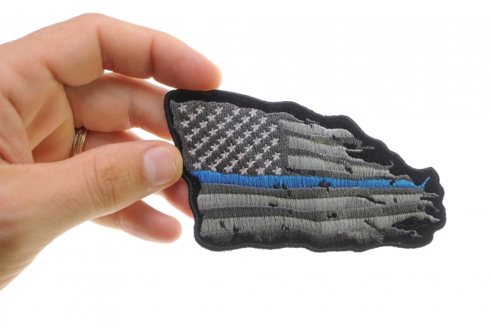 Thin Blue Line American Tattered Flag Patch shown on hand for size comparison