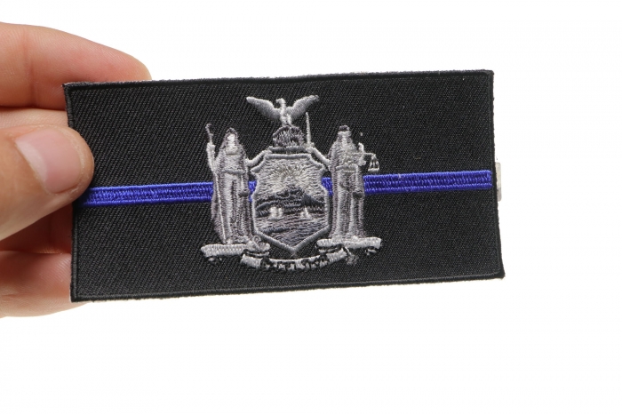Thin Blue Line New York State Flag Patch For Law Enforcement shown on hand for size comparison