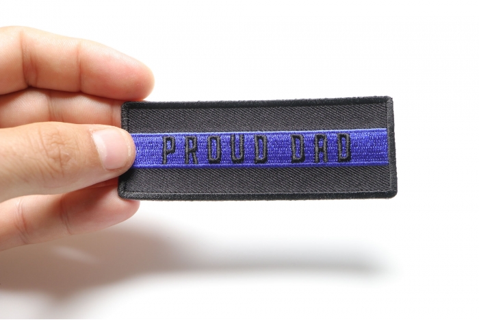 Thin Blue Line Proud Dad Patch shown on hand for size comparison