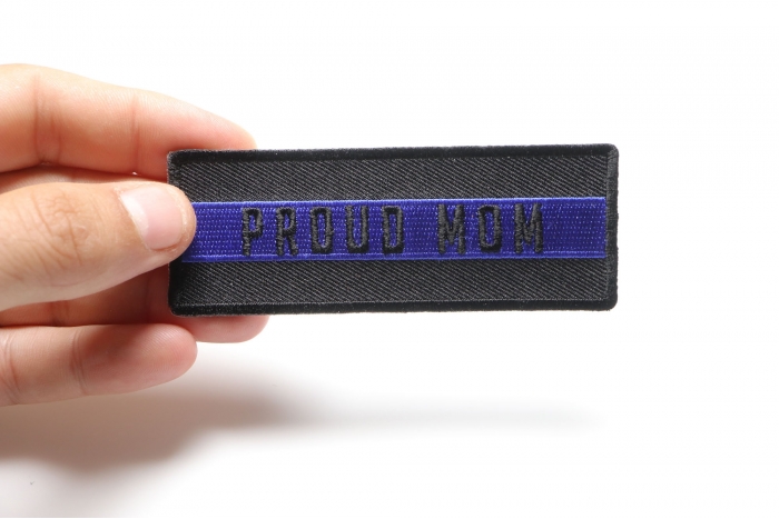 Thin Blue Line Proud Mom Patch shown on hand for size comparison