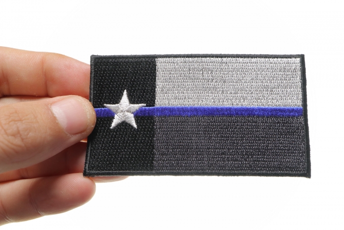 Thin Blue Line Texas State Flag Patch For Law Enforcement shown on hand for size comparison