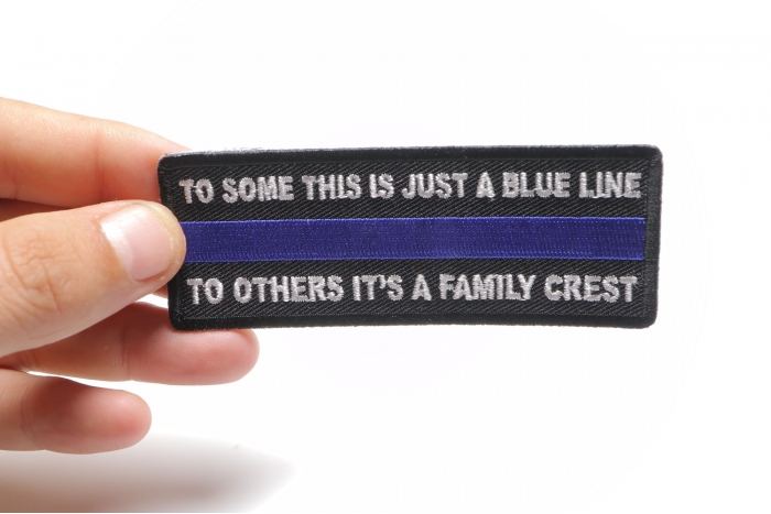 To Some This is Just a Blue Line To Others It's a Family Crest Patch shown on hand for size comparison