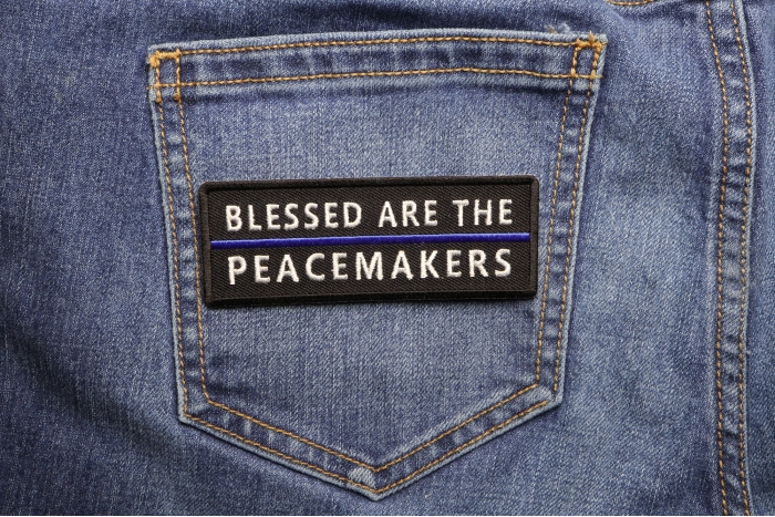 Blessed Are The Peacemakers Blue Line Patch shown on jeans