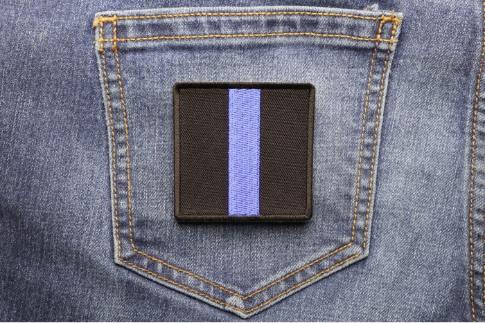 Blue Line Police Family Patch shown on jeans
