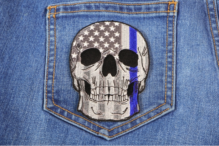 Blue Stripe American Flag Skull Police Patch shown on jeans