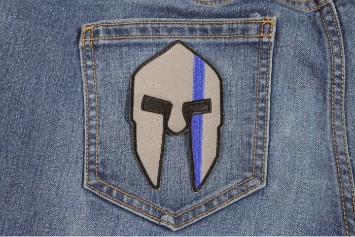 Spartan Helmet Patch with Blue Stripe shown on jeans