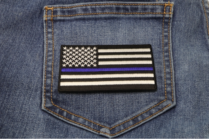 Subdued US Flag With Blue Stripe Patch shown on jeans