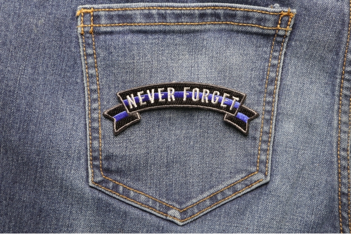 Thin Blue Line Never Forget Rocker Patch shown on jeans