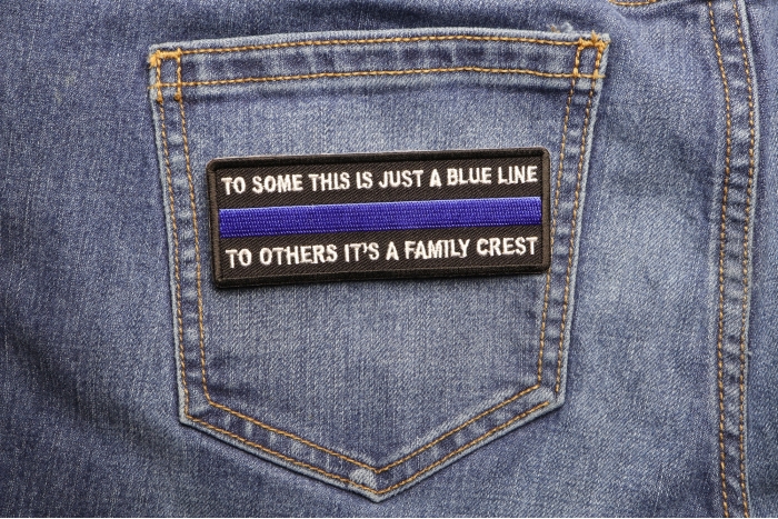 To Some This is Just a Blue Line To Others It's a Family Crest Patch shown on jeans