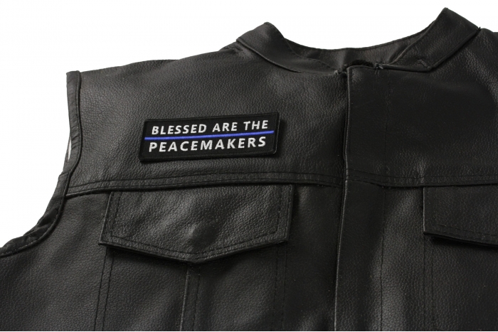 Blessed are The Peacemakers Blue Line Patch - 4x1.3 inch. Embroidered Iron on Patch shown on leather vest
