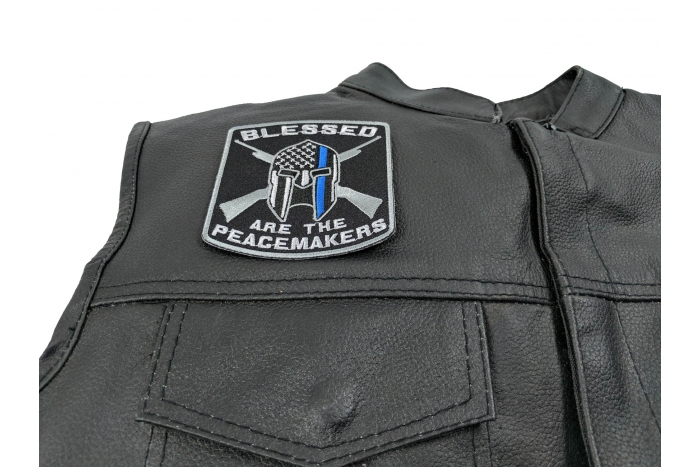 Blessed Are The Peacemakers Thin Blue Line Patch - 3.5x3.75 inch Embroidered Iron on Patch shown on leather vest