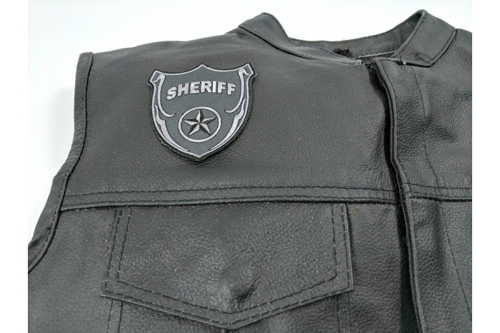  shown on leather vest