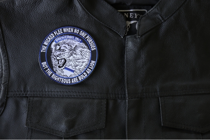 The Righteous are Bold as Lions Patch - 4x4 inch. Embroidered Iron on Patch shown on leather vest