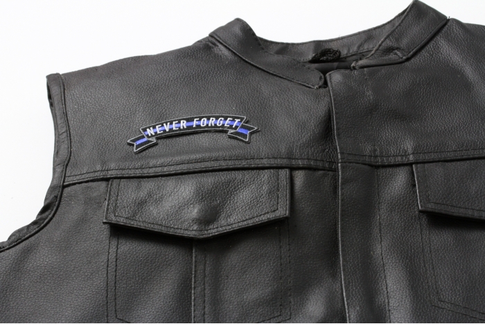 Thin Blue Line Never Forget Rocker Patch - 4x1.4 inch. Embroidered Iron on Patch shown on leather vest