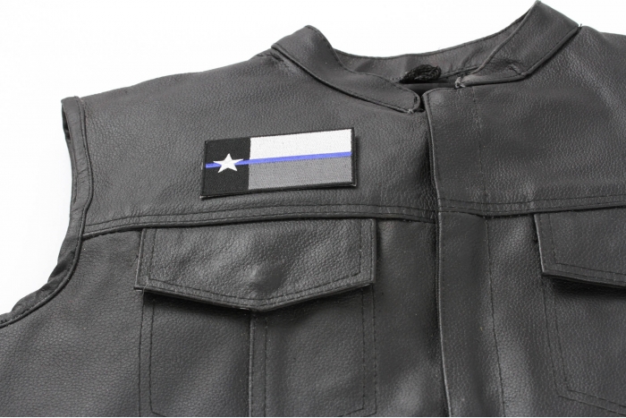 Thin Blue Line Texas State Flag Patch - 3.5x2 inch. Embroidered Iron on Patch shown on leather vest