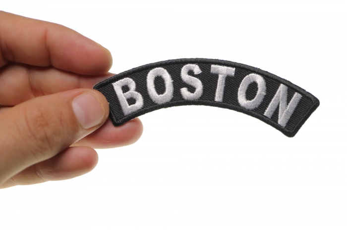 Boston Patch shown on hand for size comparison