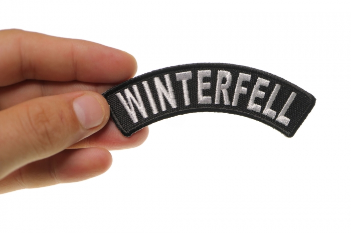 Winterfell Patch shown on hand for size comparison