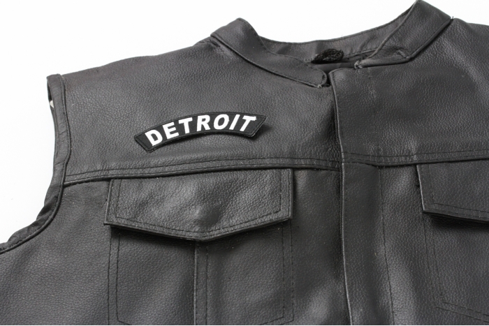 Detroit Patch - 4x1 inch. Embroidered Iron on Patch shown on leather vest