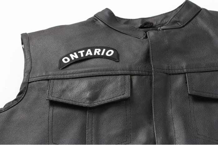 Ontario City Patch - 4x1.75 inch. Embroidered Iron on Patch shown on leather vest