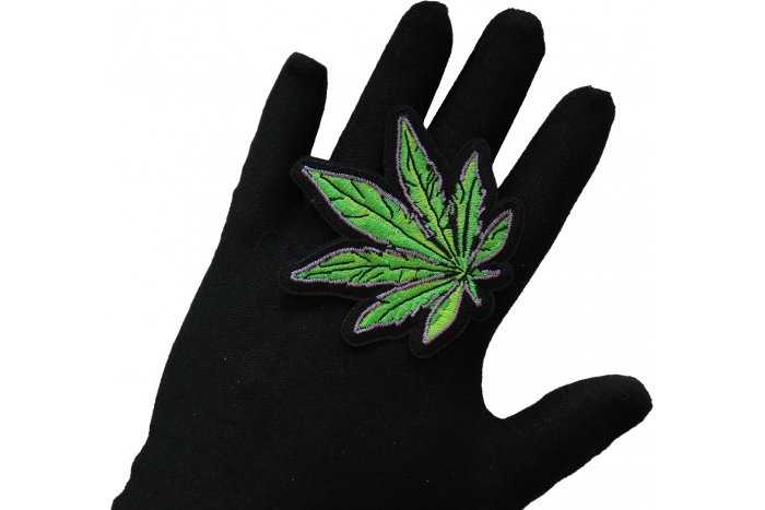 Pot Leaf Iron on Patch shown on hand for size comparison