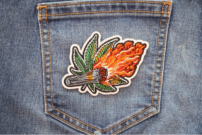 Joint on Fire Patch shown on jeans
