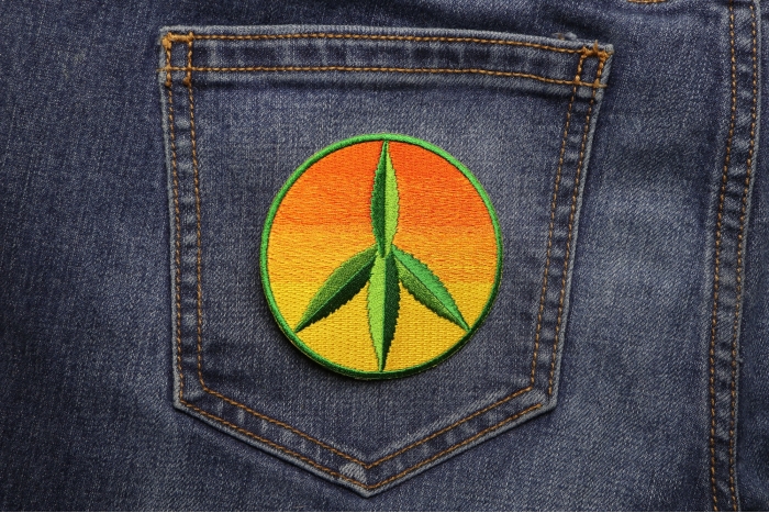Peace Cannabis Leaf Iron on Hippie Patch shown on jeans