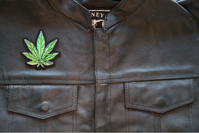 Pot Leaf Iron on Patch shown on leather vest