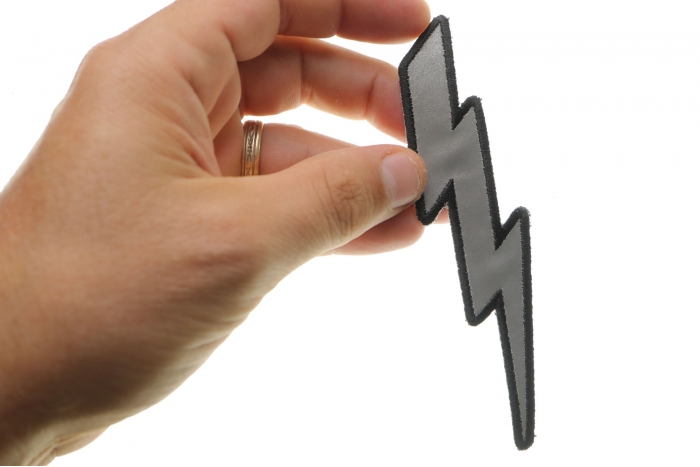 Reflective Lightning Bolt Left Patch shown on hand for size comparison