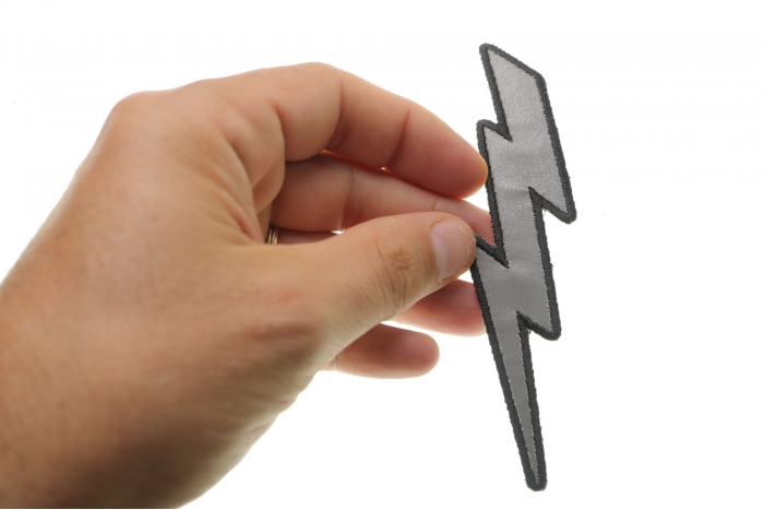 Reflective Lightning Bolt Right Patch shown on hand for size comparison
