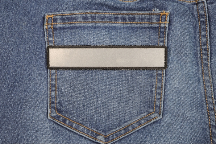 Small Reflective 5 Inch Strip Patch shown on jeans